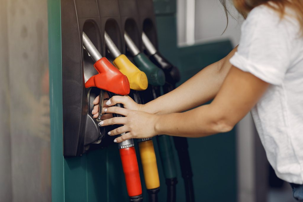 person holding a gas pump