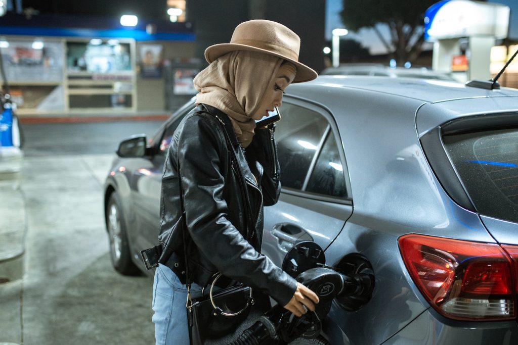 woman filling up the gas tank