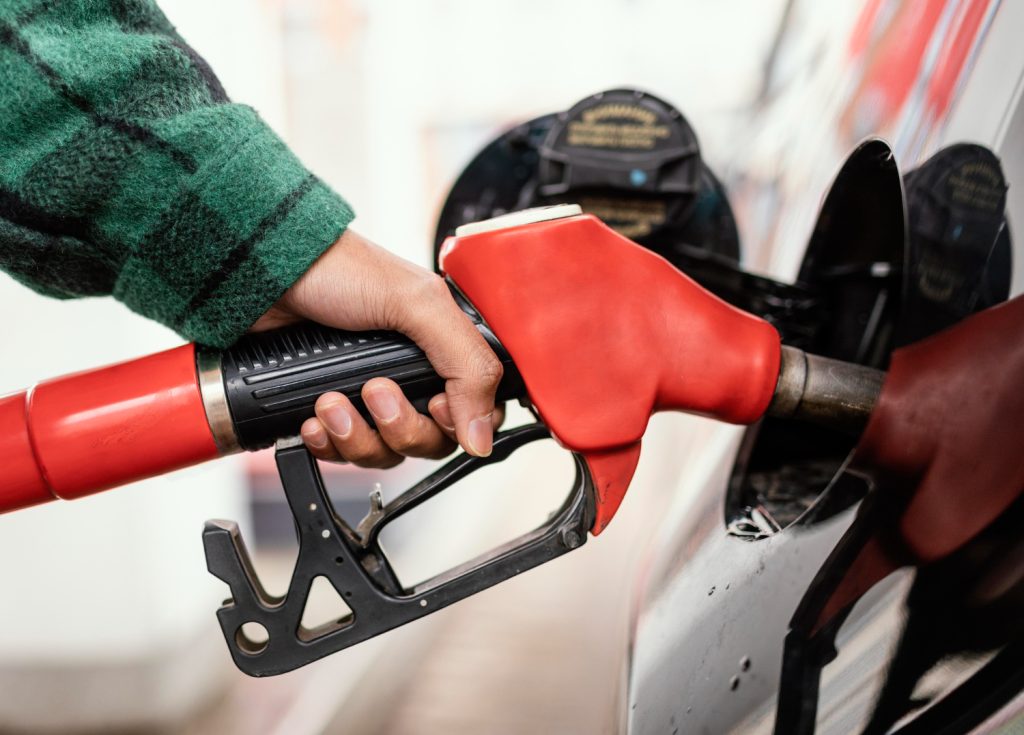 person holding a gas pump