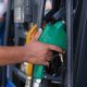 person holding gas pump