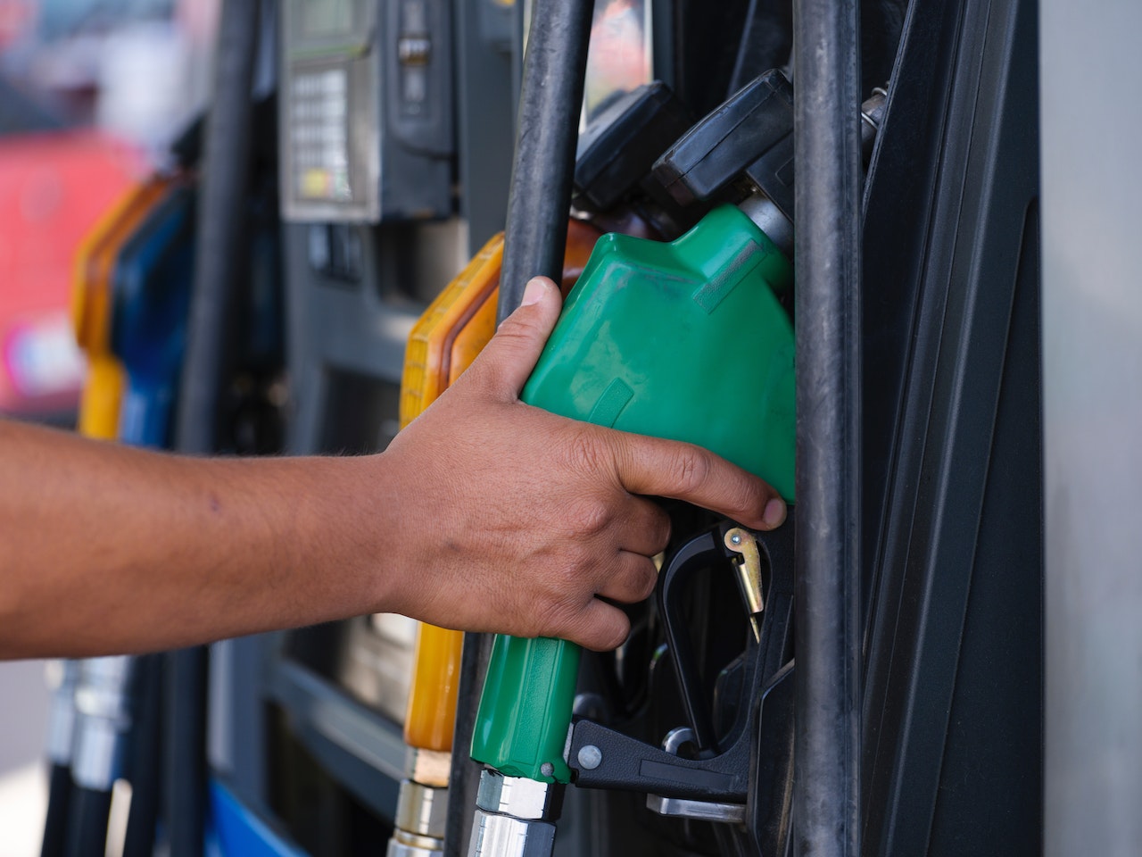 person holding gas pump